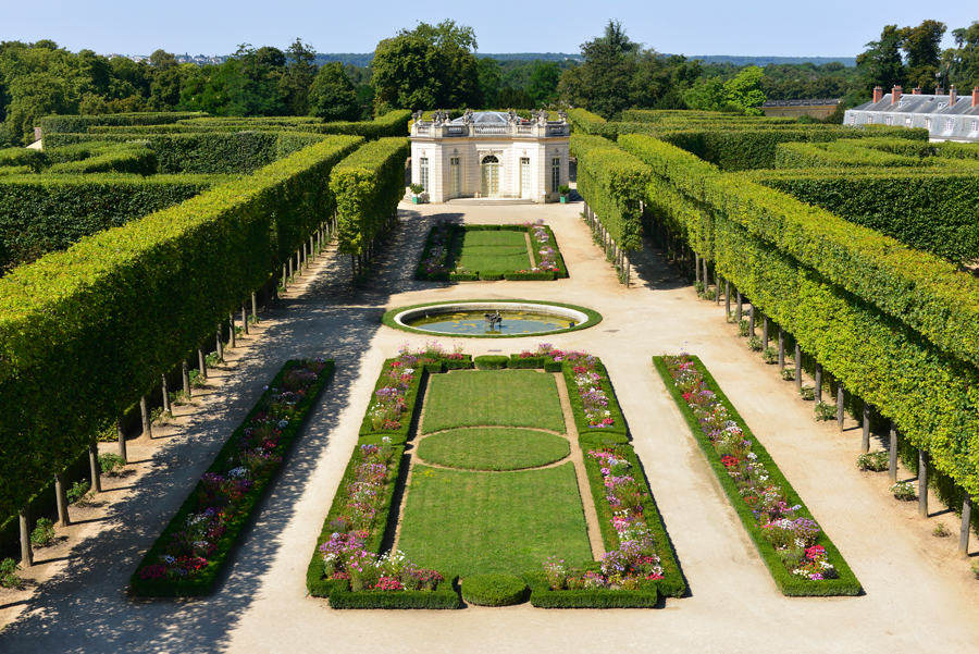 The French Gardens Of The Petit Trianon Palace Of Versailles