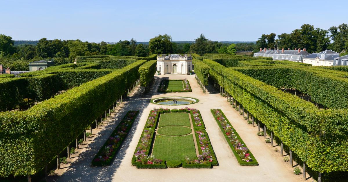 The French Gardens Of The Petit Trianon Palace Of Versailles